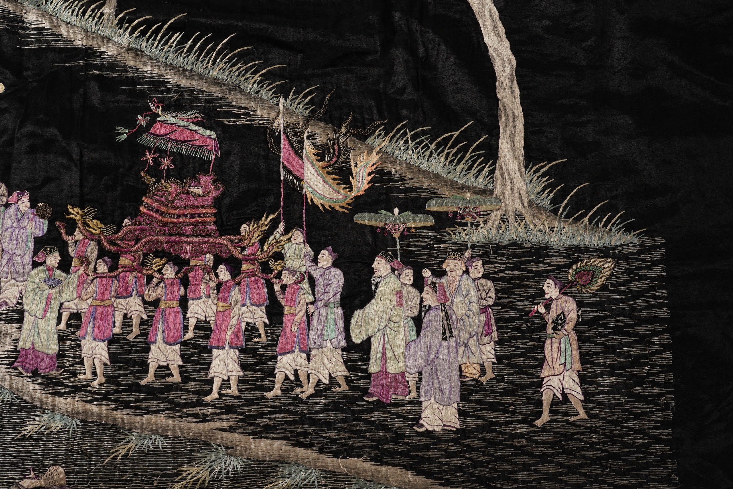 Four Chinese embroidered silk panels, late 19th/early 20th century and a similar Indian panel